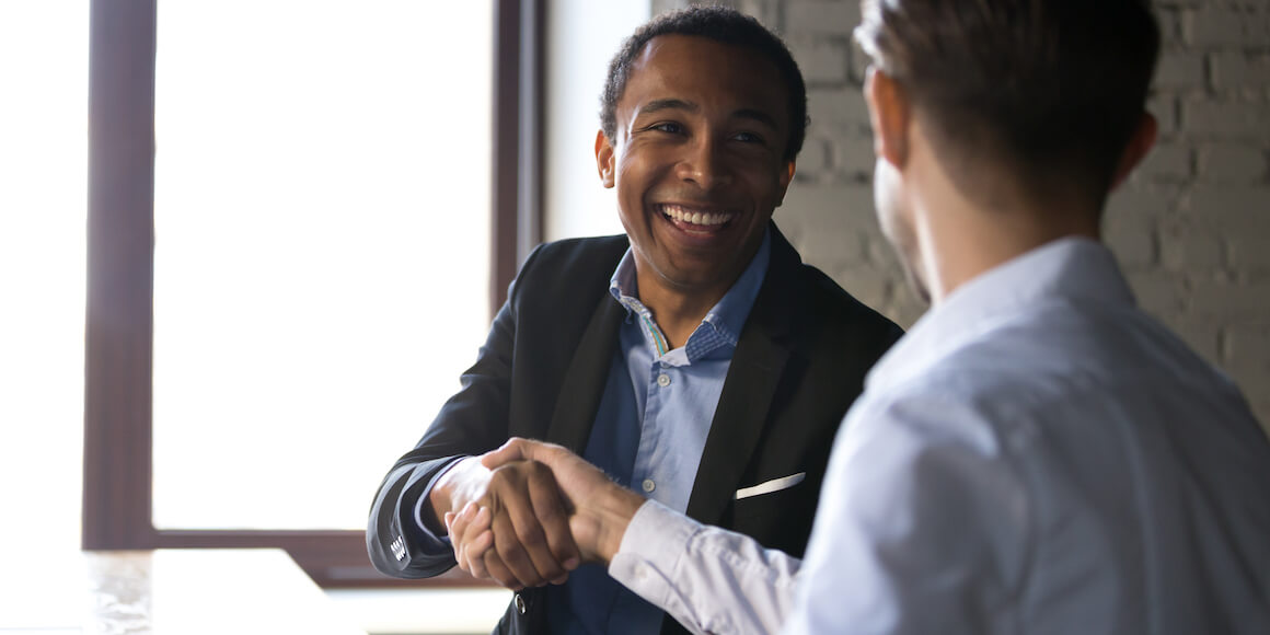 Two business men shaking hands